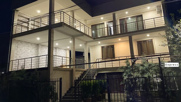 A multi-story hotel with a modern design, featuring balconies, a staircase, and a well-lit facade. - Hotel Charli (Kobuleti)