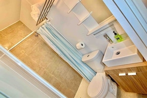 Shower, hair dryer, towels, soap