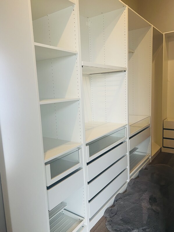 A white storage unit with multiple shelves and drawers, likely used for organizing personal items. - Spacious villa in the Golden Circle with incredible views & a hot tub! (Reykholt)
