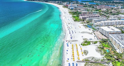 Stunning Pool-side 2 bed/2 Bath With A Quick Walk to Beach!!