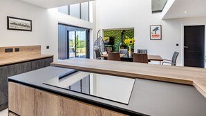 A modern interior with a reception desk, seating area, and a large window. - 5 bedroom accommodation in Marldon, near Paignton (Marldon, near Paignton)