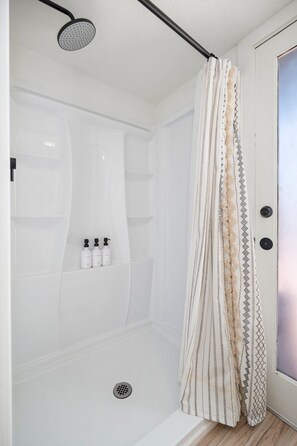 Shower, hair dryer, towels, soap