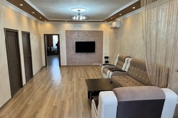 Living room #1, TV and Sofa-bed plus 2 Sofa Chairs that turn into a single bed.