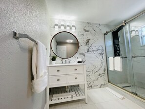 Shower, hair dryer, towels, soap