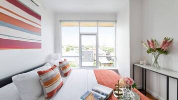 1 bedroom, desk, iron/ironing board, travel crib