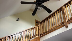 A staircase with wooden railings leading to an upper floor. - Cozy cabin Peaceful Side, Townsend, TN, Laurel Valley,  no steep roads (Townsend)