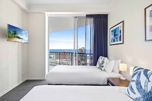 Relax in this stylish room with a large bed, city and sea views, and a flat-screen TV.
