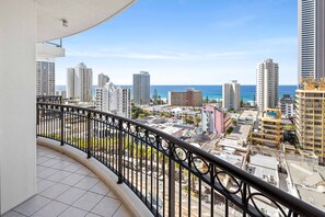 Enjoy breathtaking views of the city and ocean from this high-rise's expansive balcony.