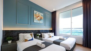 A hotel room with two beds, a large window, and a painting on the wall. - The Wave Residence By I Housing (Malacca City)