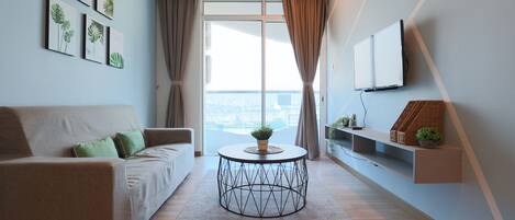 Signature Apartment, 2 Bedrooms, Pool Access, City View | Living area | 60-inch LED TV with cable channels, TV