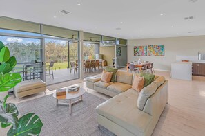 TV, books, offices - Perricoota Riverfront Townhouse | Murray River Views (Moama)