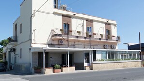 A two-story building with a ground-floor commercial space and upper residential units.