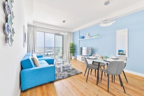 Deluxe Apartment | Living area | 50-inch Smart TV with cable channels, TV