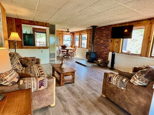 Rustic modern cabin on a cliff face with amazing views.