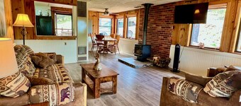 Rustic modern cabin on a cliff face with amazing views.