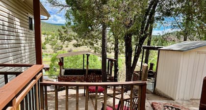Rustic modern cabin on a cliff face with amazing views.