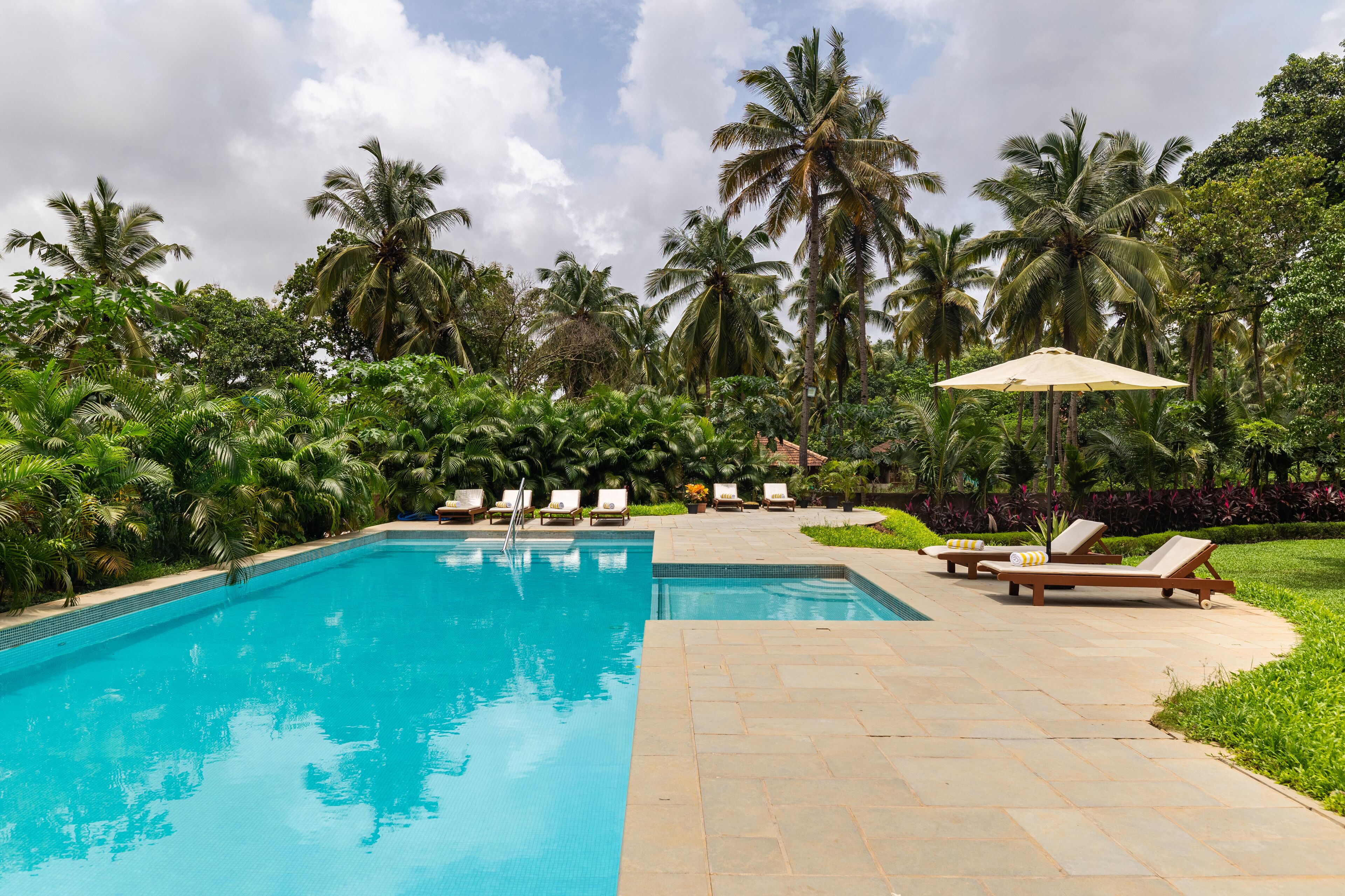 Outdoor pool, open 8:00 AM to 8:00 PM, pool umbrellas, pool loungers