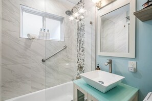 Combined shower/tub, bathrobes, towels, soap