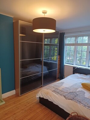 1 bedroom, desk, iron/ironing board, travel crib