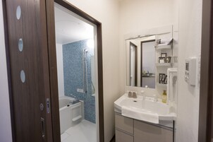 Basic Double Room | Bathroom | Hair dryer, slippers, towels, shampoo