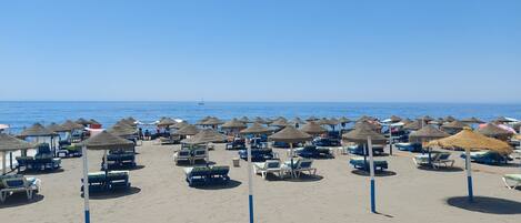 On the beach, beach towels