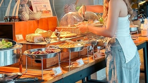 A buffet setup with various food items and a sign indicating a coffee area. - Macchiato Resort Savannakhet (Savannakhet)