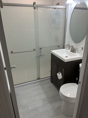 Shower, hair dryer, towels, soap