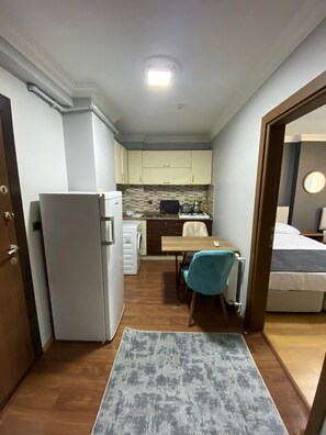 Fridge, stovetop, cookware/dishes/utensils, paper towels