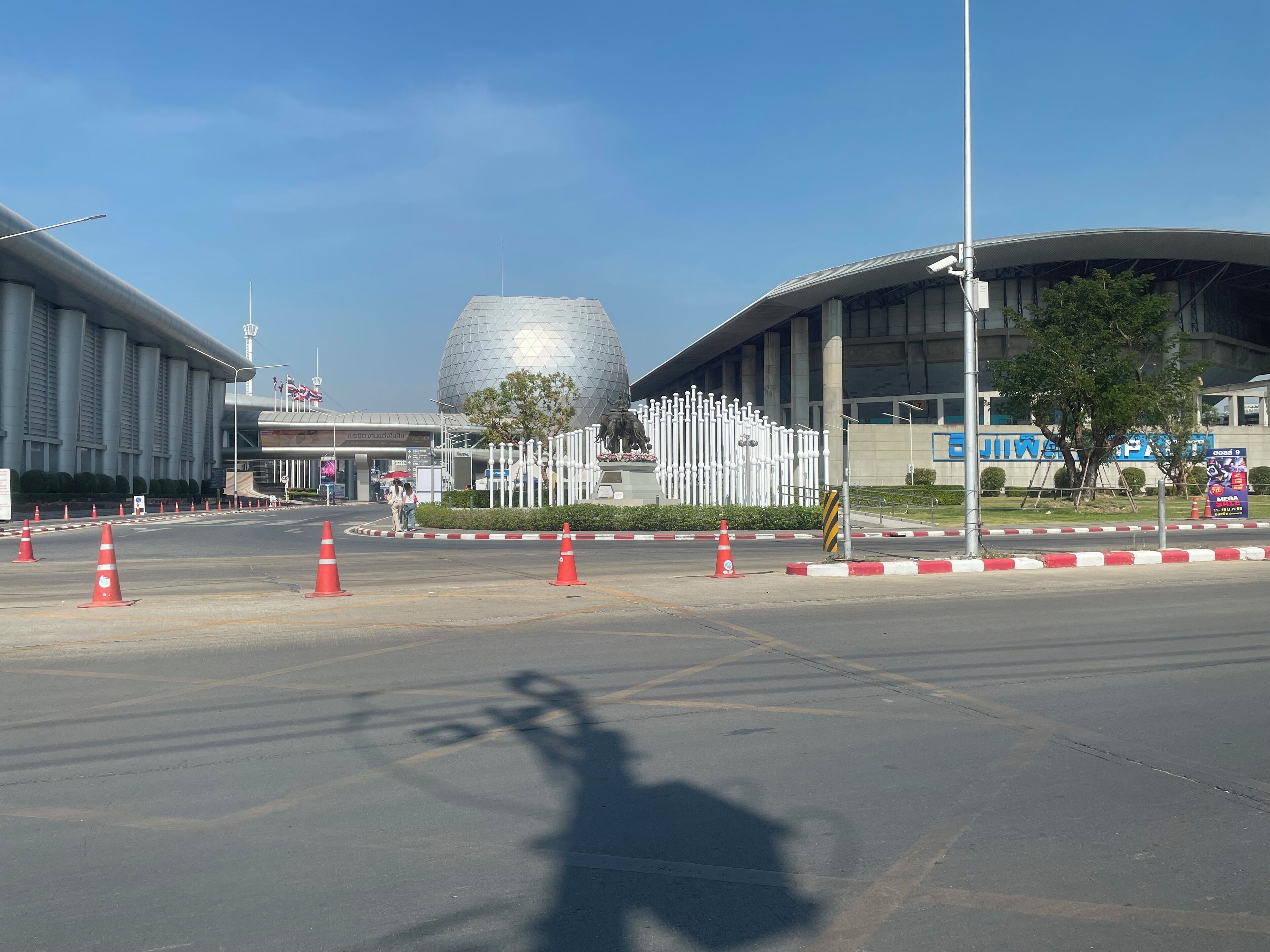 A modern building with a large dome and a curved facade.