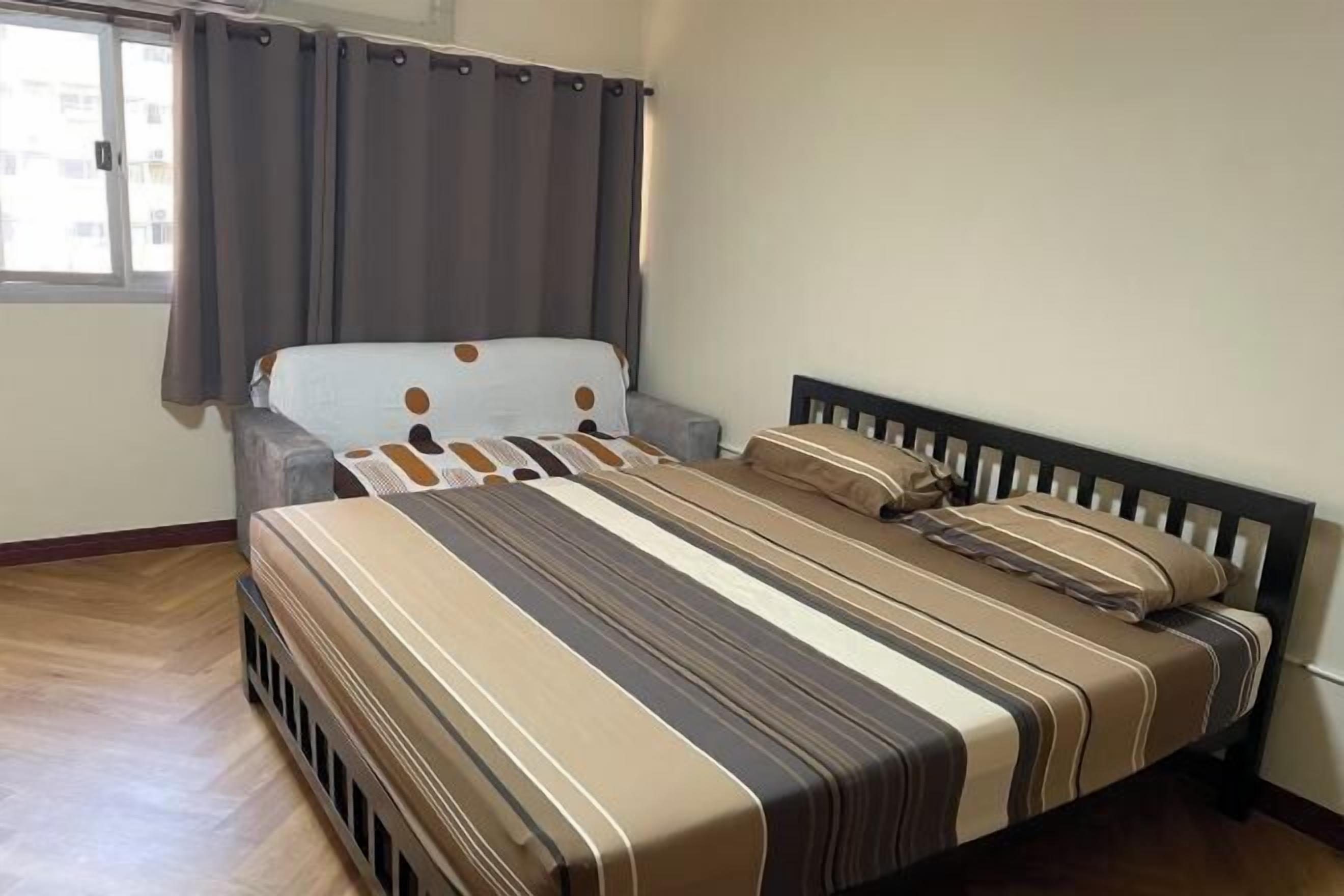 Premium bedding, desk, laptop workspace, blackout curtains