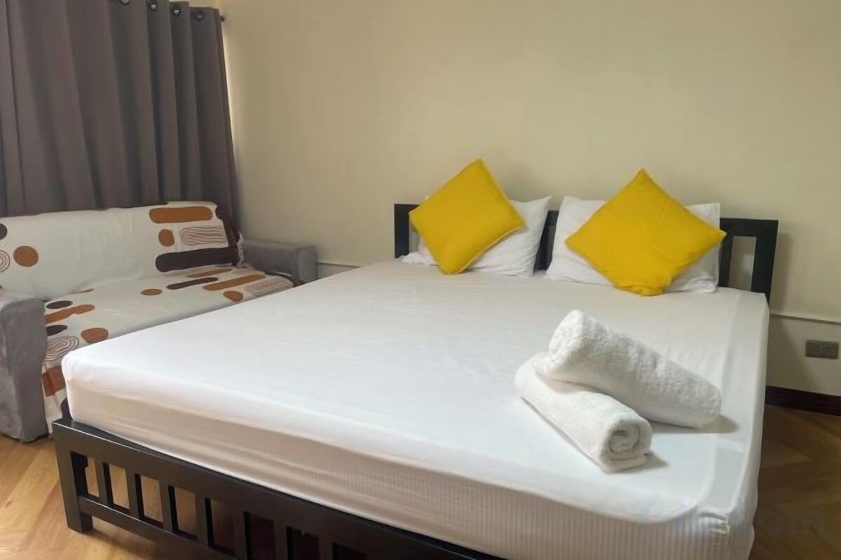 Premium bedding, desk, laptop workspace, blackout curtains