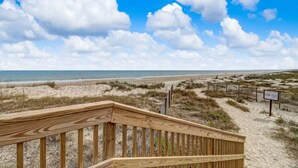 A wooden boardwalk leading to a beach with sand dunes and a clear blue sky. - AMELIA ISLAND PLANTATION VILLA 2/2 IN A GATED COMMUNITY JUST OFF BEACH LOCATION (Fernandina Beach)