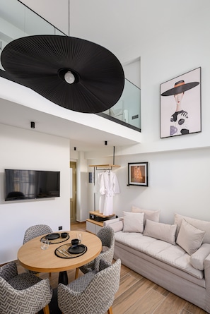 Superior Suite - Split Level | Living area | 43-inch Smart TV with cable channels, TV