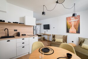 Standard Suite | Living area | 43-inch Smart TV with cable channels, TV