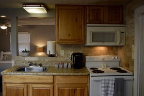 Fridge, microwave, oven, cookware/dishes/utensils