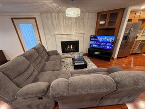 Smart TV, fireplace, books