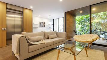 Apartment, 3 Bedrooms, Balcony (2) | Living area | 55-inch Smart TV with digital channels, TV