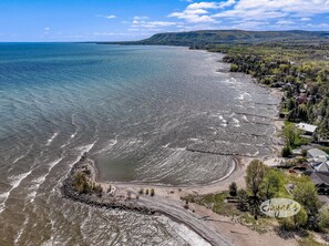 Enjoy expansive views of the coastline and surrounding hills from this traditional beachfront property.