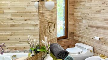 Baignoire à jets, bidet, serviettes fournies, savon