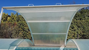 A swimming pool with a clear blue water surface, surrounded by a stone deck. - FAMILY HOUSE FOR 6 PEOPLE (Lit-et-Mixe)