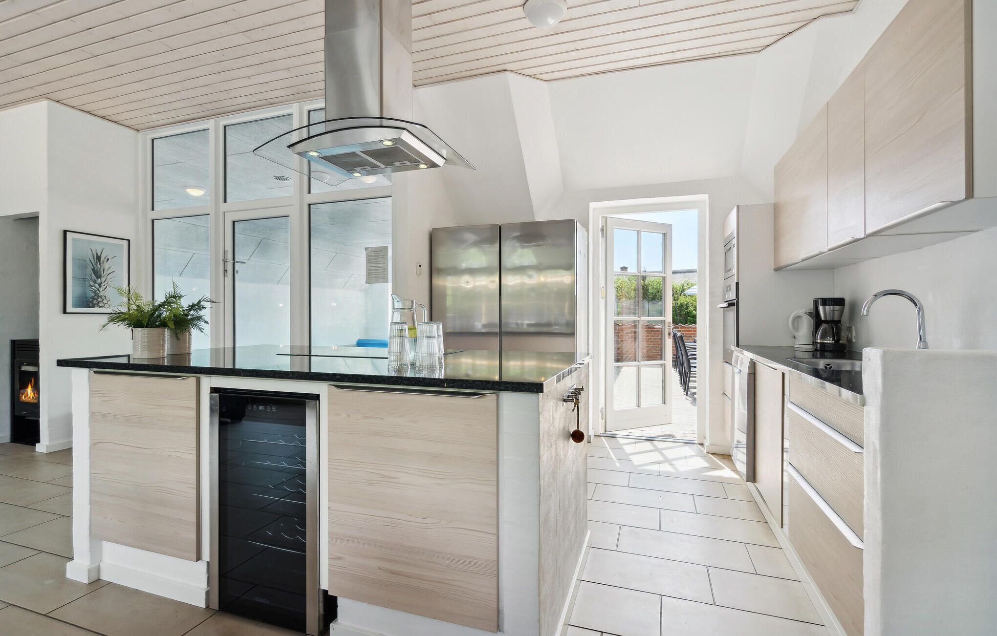 Fridge, stovetop, dishwasher, coffee/tea maker