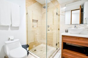 Deluxe Studio | Bathroom | Shower, hair dryer, towels, soap