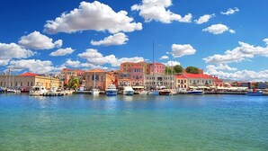 A harbor with colorful buildings and boats. - Cretan Stone Villa, A/C, Private Pool, Spectacular 360° Views of the Countryside, Coastline & Sea! (Stalos)