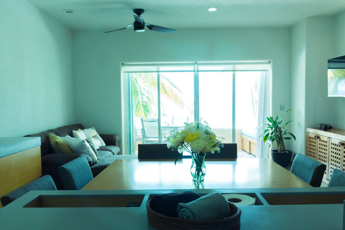 Departamento Confort, varias camas | Área de sala de estar