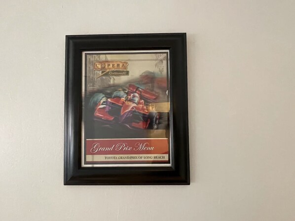 A framed picture of a racing car with the text "Grand Prix Monaco" and "TOYOTA GRAND PRIX OF LONG BEACH".