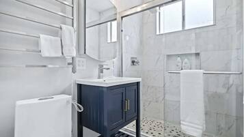 Shower, hair dryer, towels, soap
