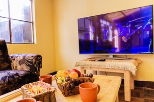 Standard Apartment | Living area | 14-inch flat-screen TV with cable channels, TV