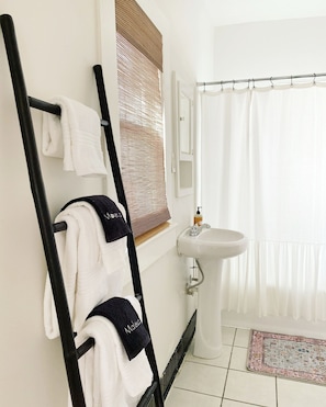 Hair dryer, towels, soap, shampoo