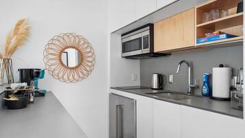 Fridge, microwave, stovetop, coffee/tea maker