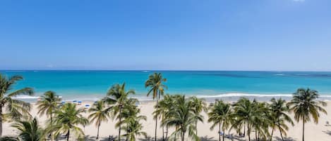 On the beach, sun loungers, beach towels